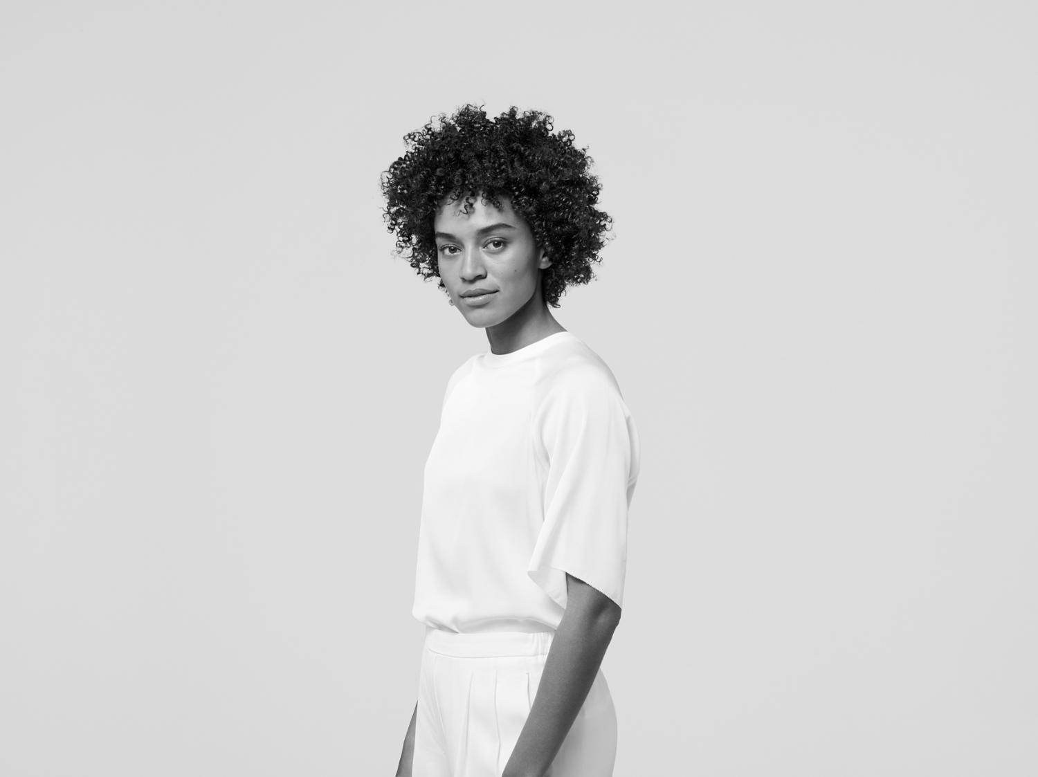 Model with a haircut featuring texture and coils.